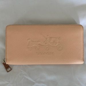 Authentic Coach accordion large wallet. Never used. Zip around closure.